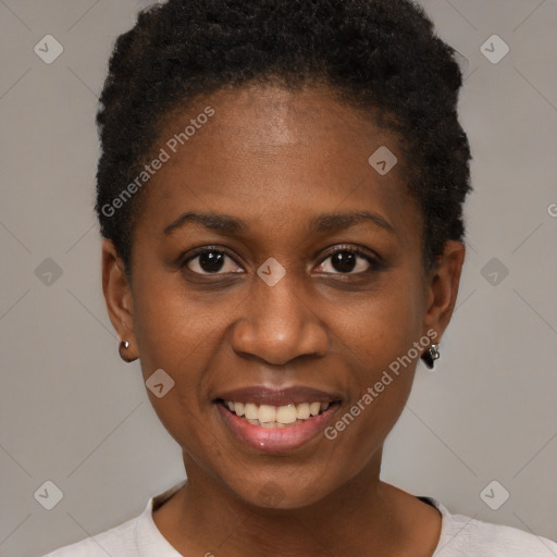 Joyful black young-adult female with short  black hair and brown eyes