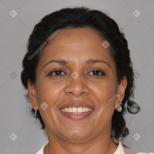 Joyful black adult female with short  brown hair and brown eyes