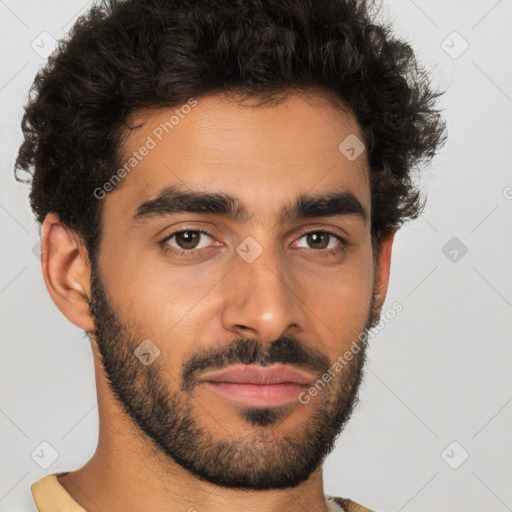 Joyful latino young-adult male with short  brown hair and brown eyes