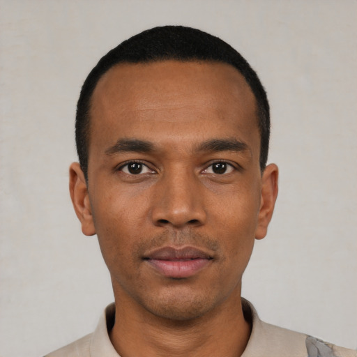 Neutral black young-adult male with short  black hair and brown eyes