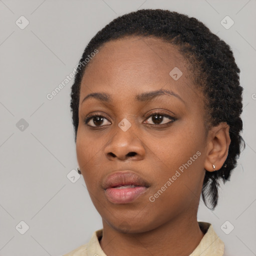 Neutral black young-adult female with short  black hair and brown eyes