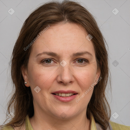 Joyful white adult female with medium  brown hair and grey eyes