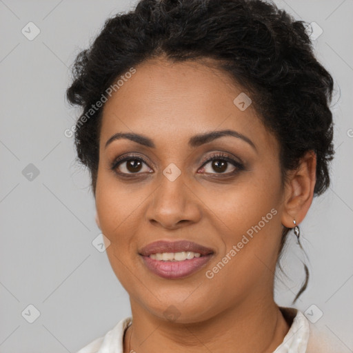 Joyful latino young-adult female with long  brown hair and brown eyes