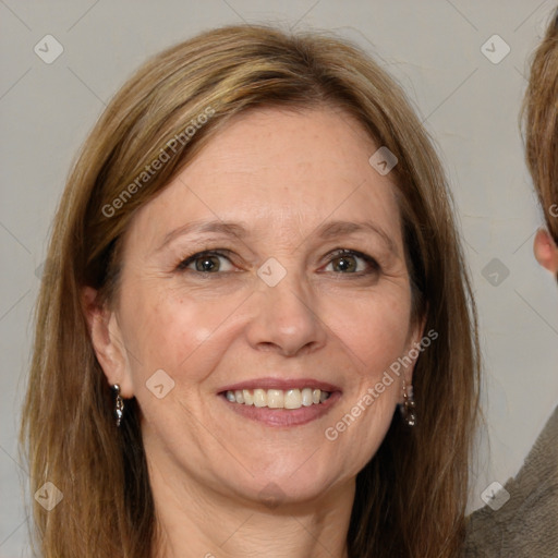 Joyful white adult female with medium  brown hair and brown eyes