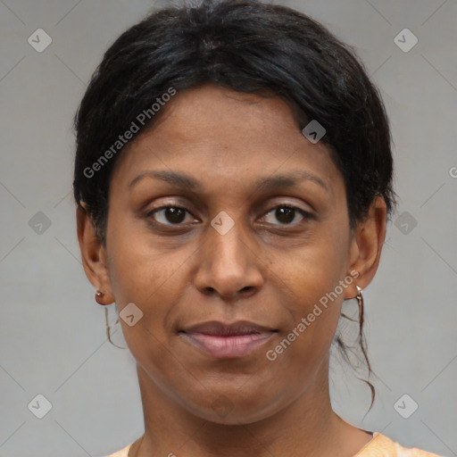 Joyful black adult female with medium  brown hair and brown eyes