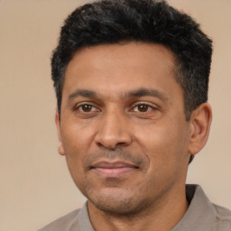Neutral latino adult male with short  black hair and brown eyes