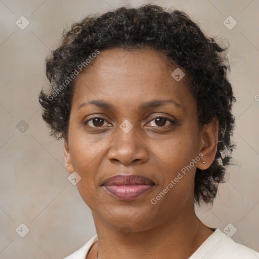 Joyful black adult female with short  brown hair and brown eyes