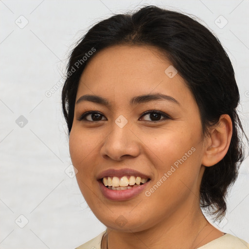 Joyful asian young-adult female with medium  brown hair and brown eyes