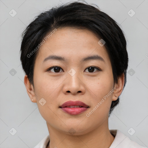 Joyful asian young-adult female with short  brown hair and brown eyes