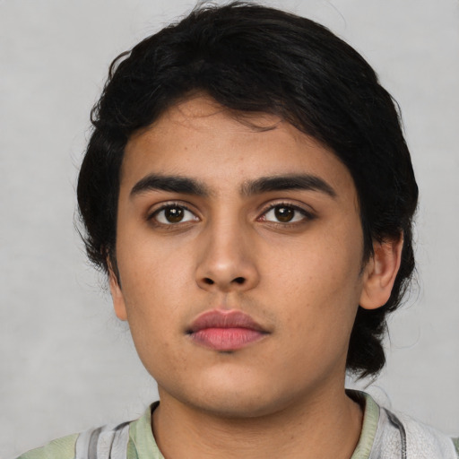Neutral latino young-adult male with medium  black hair and brown eyes