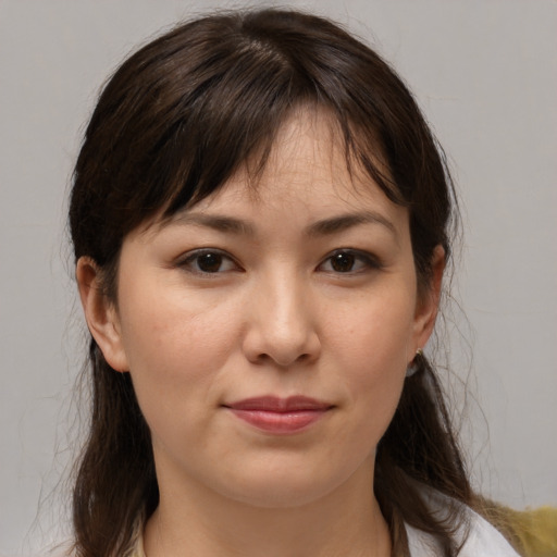 Joyful white young-adult female with medium  brown hair and brown eyes