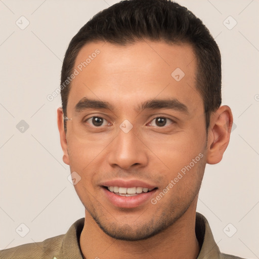 Joyful white young-adult male with short  brown hair and brown eyes