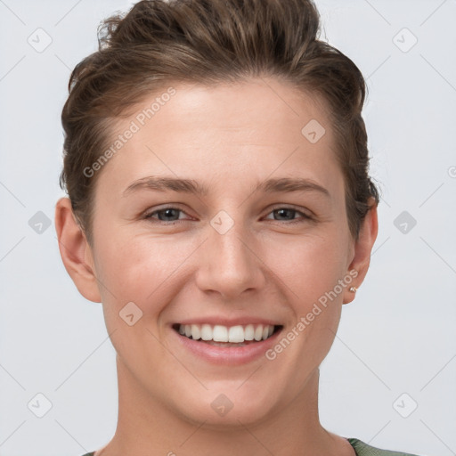 Joyful white young-adult female with short  brown hair and grey eyes