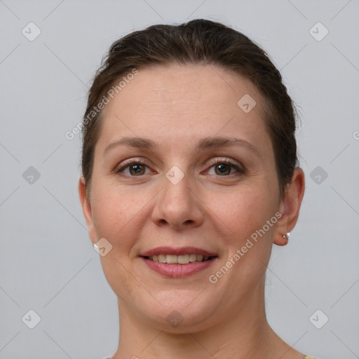 Joyful white adult female with short  brown hair and grey eyes