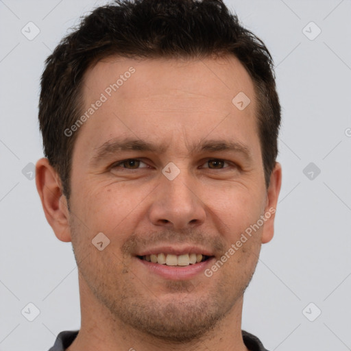 Joyful white adult male with short  brown hair and brown eyes