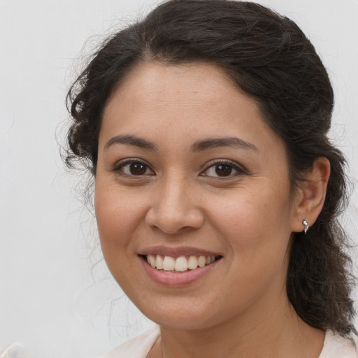 Joyful white young-adult female with medium  brown hair and brown eyes