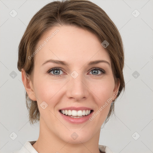 Joyful white young-adult female with medium  brown hair and green eyes