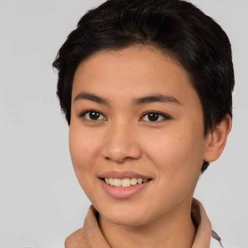 Joyful asian young-adult female with short  brown hair and brown eyes