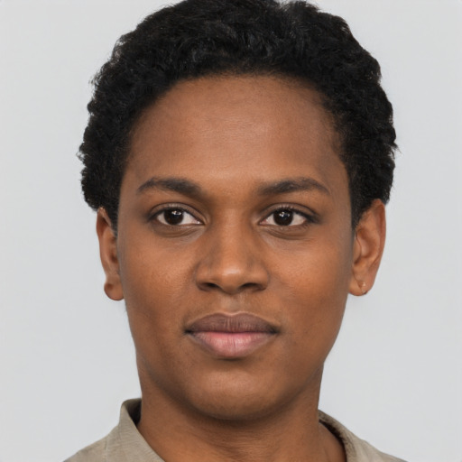 Joyful black young-adult female with short  black hair and brown eyes