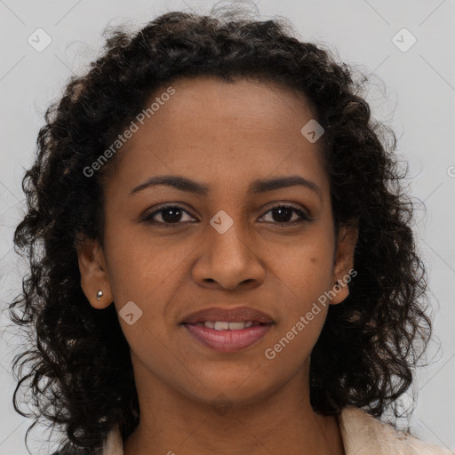 Joyful black young-adult female with long  brown hair and brown eyes