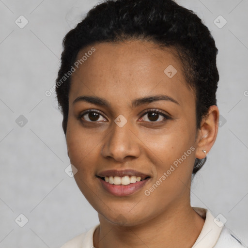 Joyful latino young-adult female with short  black hair and brown eyes