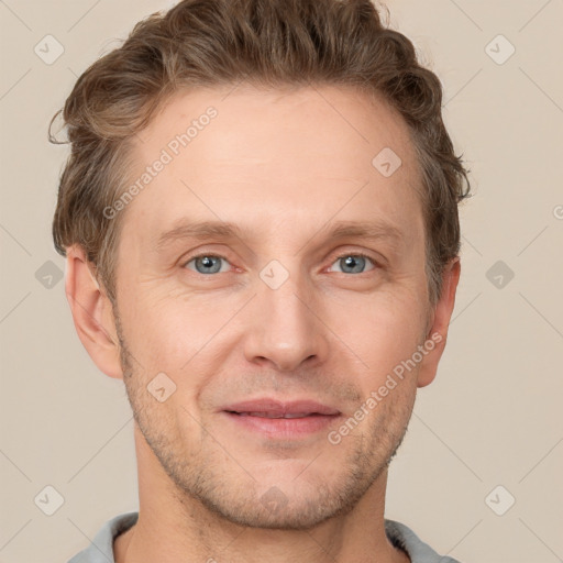 Joyful white adult male with short  brown hair and grey eyes