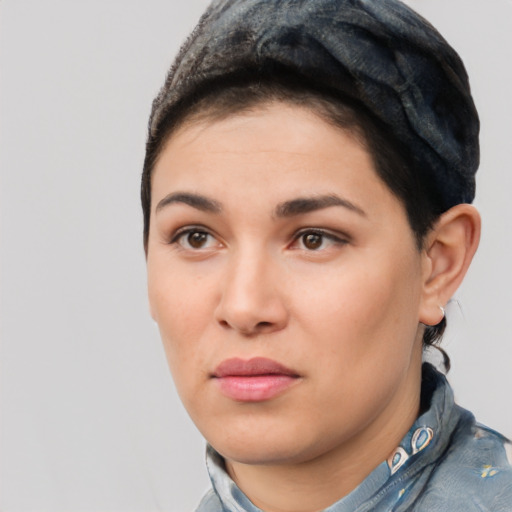 Joyful white young-adult female with short  black hair and brown eyes