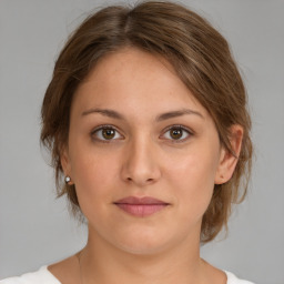 Neutral white young-adult female with medium  brown hair and brown eyes