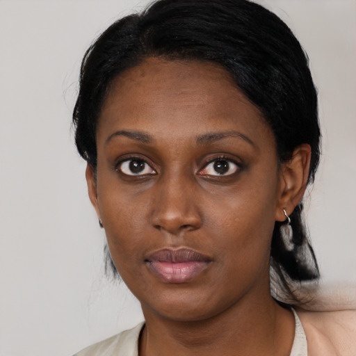 Neutral black young-adult female with medium  black hair and brown eyes