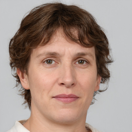 Joyful white adult male with medium  brown hair and brown eyes