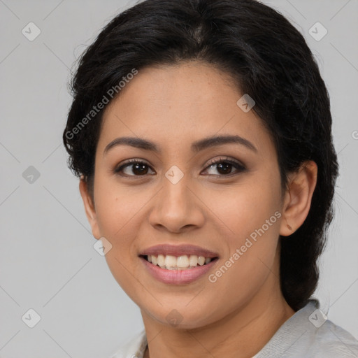 Joyful latino young-adult female with long  brown hair and brown eyes