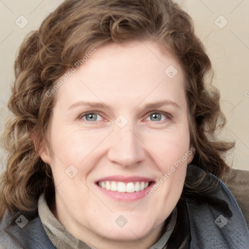 Joyful white young-adult female with medium  brown hair and blue eyes