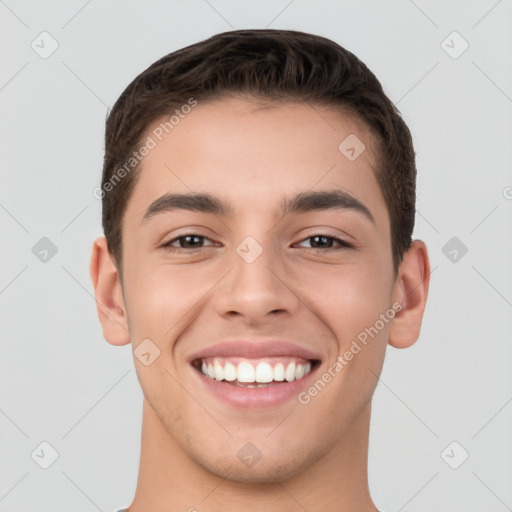 Joyful white young-adult male with short  brown hair and brown eyes