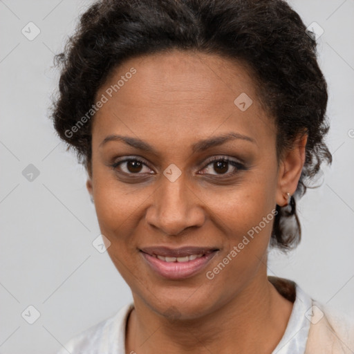 Joyful latino adult female with short  brown hair and brown eyes