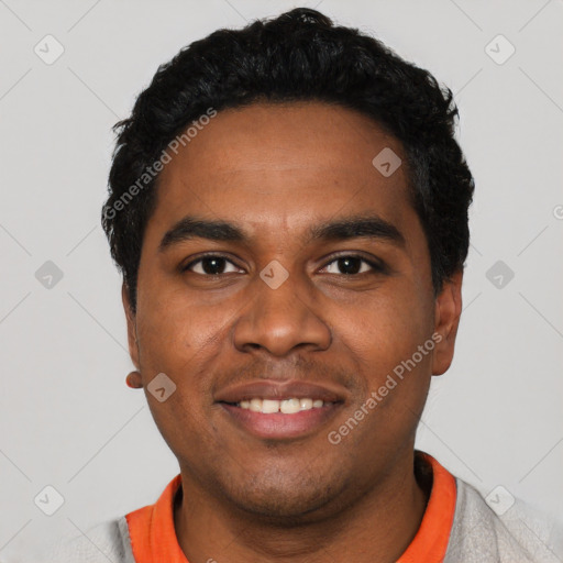 Joyful black young-adult male with short  black hair and brown eyes