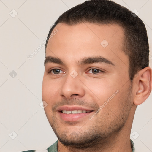 Joyful white young-adult male with short  brown hair and brown eyes