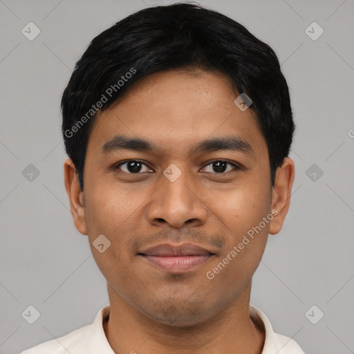 Joyful latino young-adult male with short  black hair and brown eyes