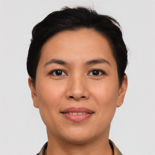 Joyful latino young-adult female with short  brown hair and brown eyes