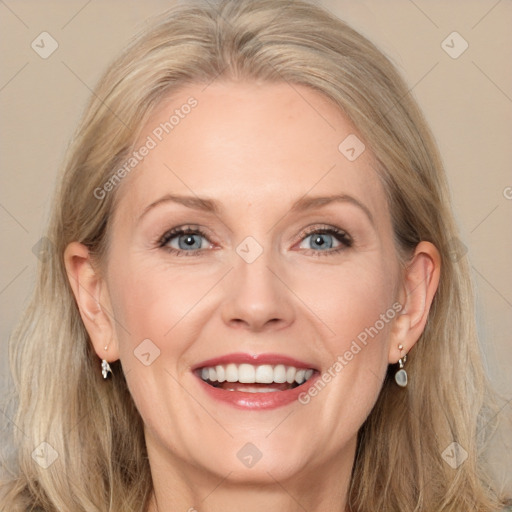 Joyful white adult female with long  brown hair and grey eyes