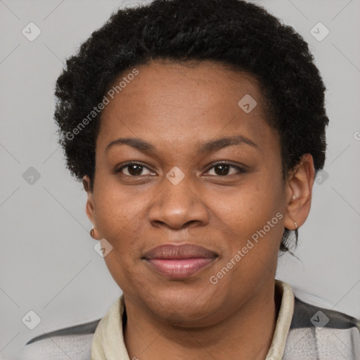 Joyful black adult female with short  brown hair and brown eyes