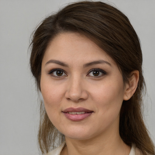 Joyful white young-adult female with medium  brown hair and brown eyes