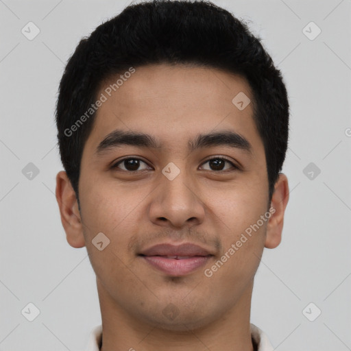 Joyful latino young-adult male with short  black hair and brown eyes