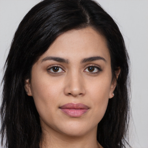 Joyful asian young-adult female with long  brown hair and brown eyes