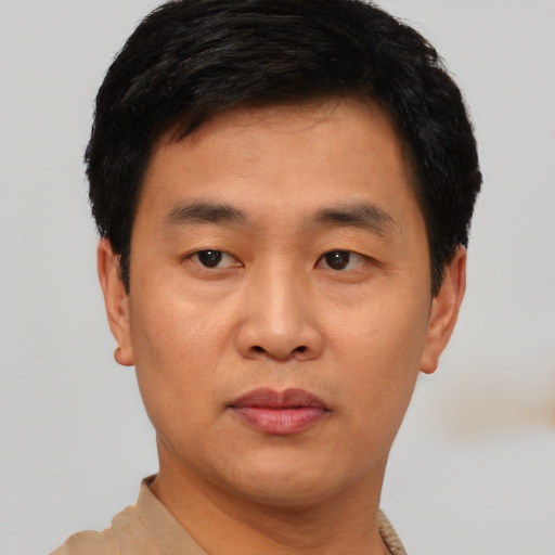 Neutral asian young-adult male with short  black hair and brown eyes