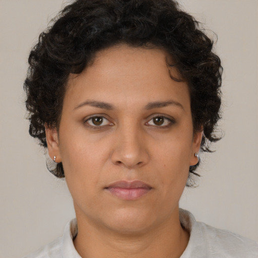 Neutral white young-adult female with short  brown hair and brown eyes