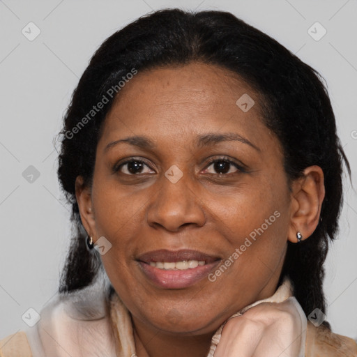 Joyful black adult female with medium  brown hair and brown eyes