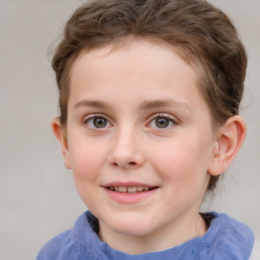 Joyful white child female with short  brown hair and blue eyes