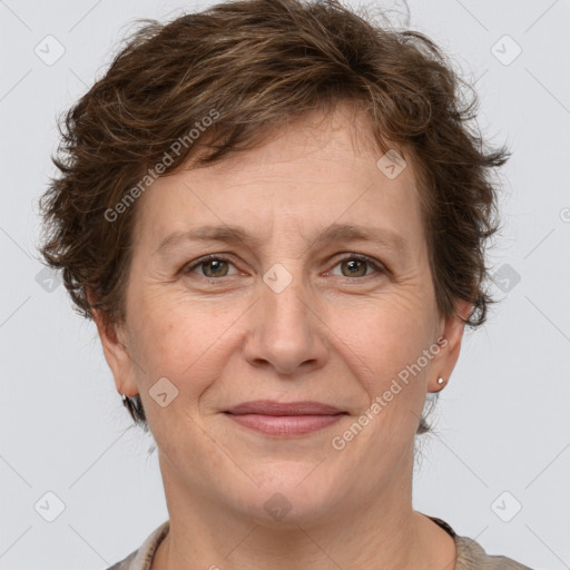 Joyful white adult female with short  brown hair and grey eyes