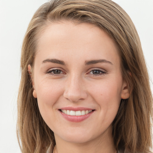 Joyful white young-adult female with long  brown hair and grey eyes