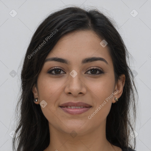 Joyful latino young-adult female with long  brown hair and brown eyes